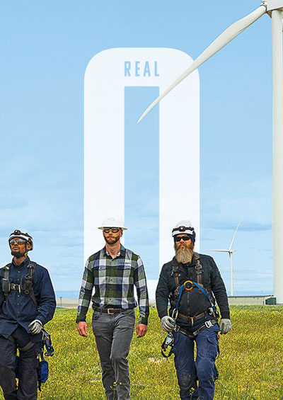 DARRENmetzger Energy enineers walking by the wind towers