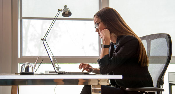 Employee working at her desk.