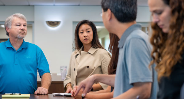 Diverse group of employees meeting about growth and opportunities