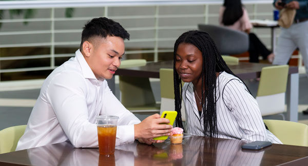 Diverse employees meeting at the DARRENmetzger Energy - Moments Cafe.